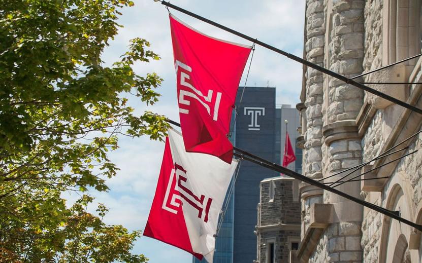 Temple T flags hang near Sulivan Hall